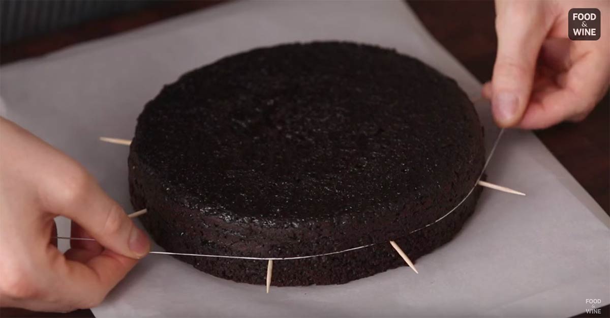 A still shot from Food & Wine’s YouTube video: “How to Cut Cake Layers with Dental Floss”