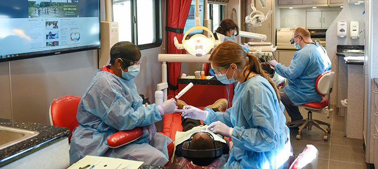 Children receiving dental care in the OHIO Project's mobile dental clinic. (Photo: Ohio State University)